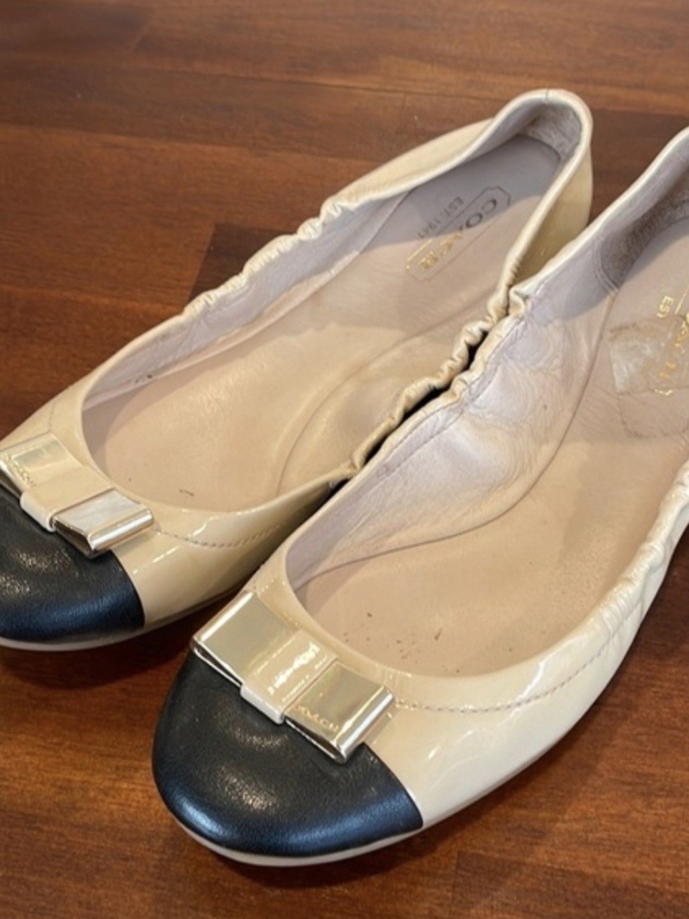 Coach Two-Tone Patent Bow Cap-Toe Ballet Flats in Beige and Black